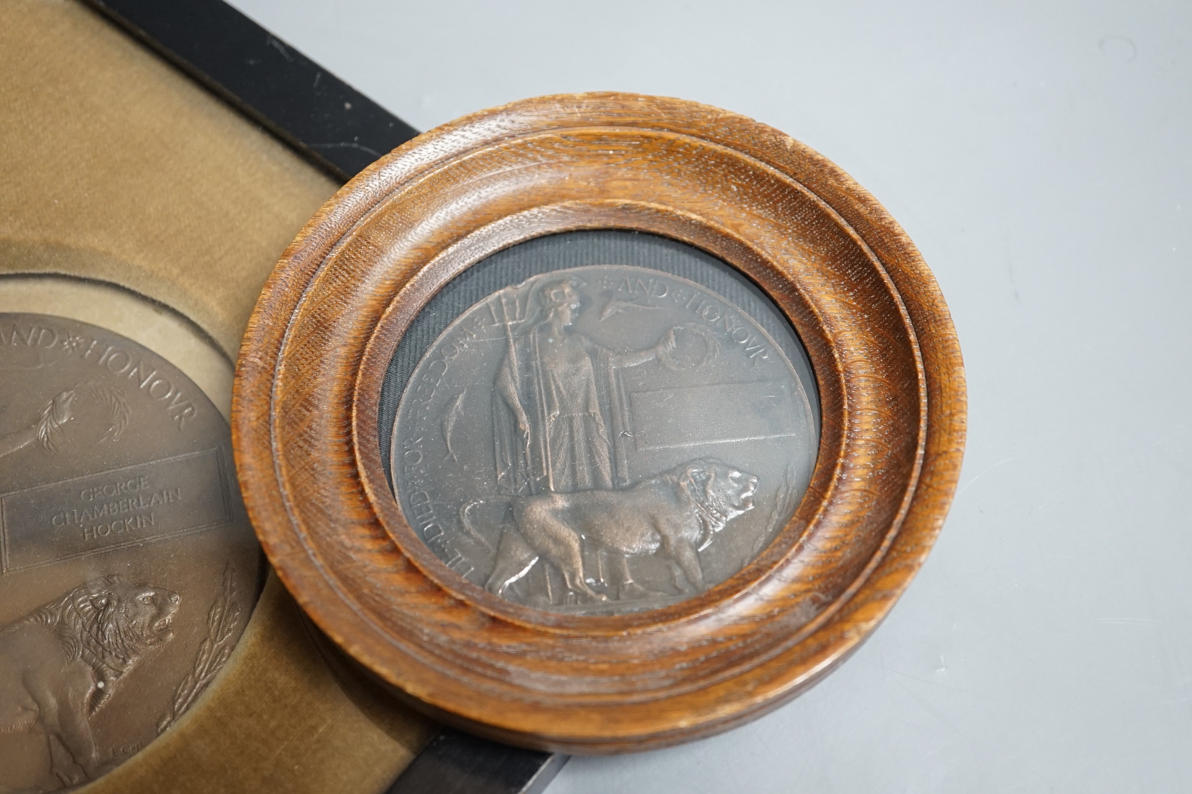 A framed WWI bronze death plaque to George Chamberlain Hockin, Lieutenant George Chamberlain Hockin of 7th Gurkha Rifles, aged 23 years killed in action at Ctesiphon, Mesopotamia, Nov. 23rd 1915, 11 cms diameter, and a r